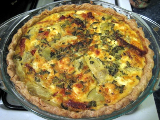 Quiche with sun dried tomatoes, basil, artichokes, goat cheese